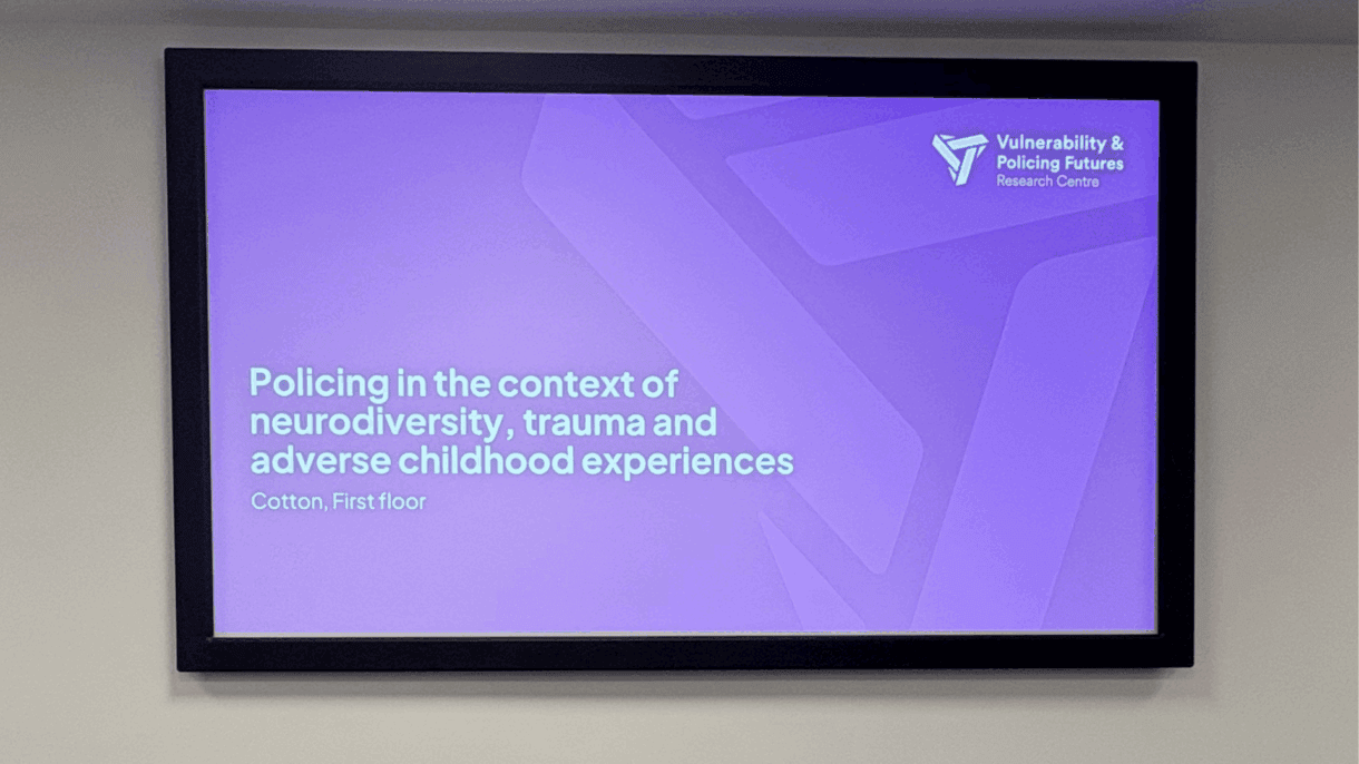Conference screen displaying the session title “Policing in the context of neurodiversity, trauma and adverse childhood experiences” at the ESRC Vulnerability & Policing Futures Research Centre Annual Conference 2025.